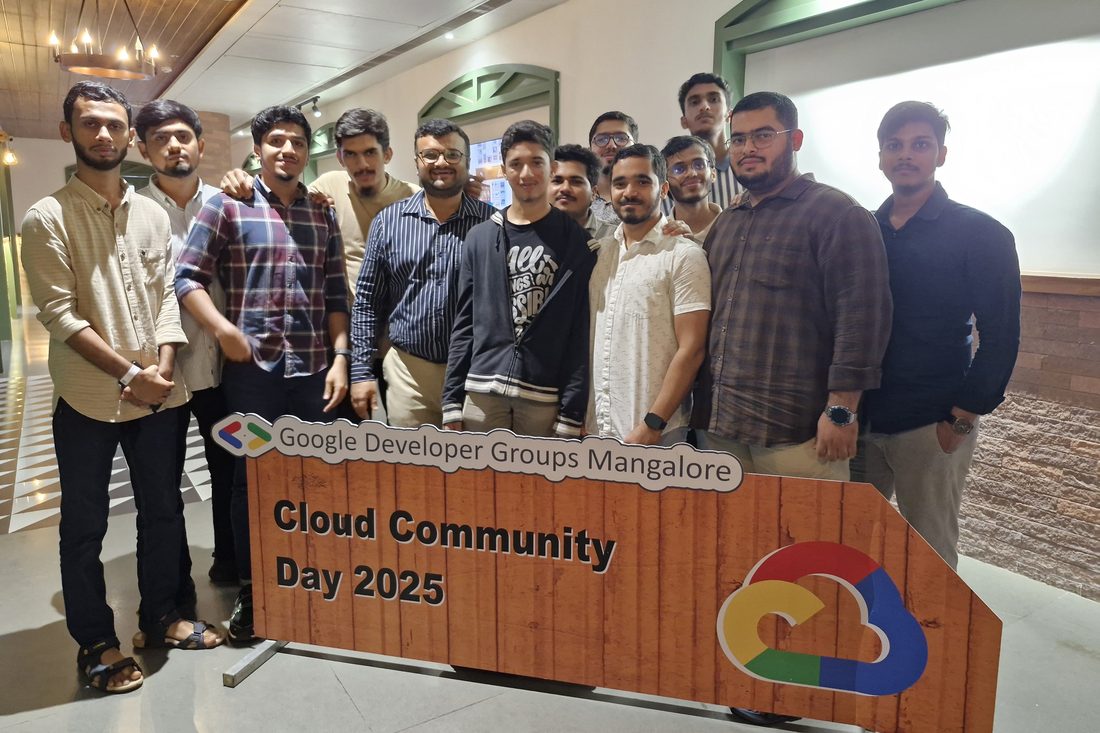Our group at the GDG Mangalore sign.